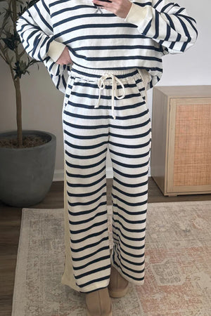 100% polyester Care instructions: Machine wash cold lounge set in White with relaxed silhouette