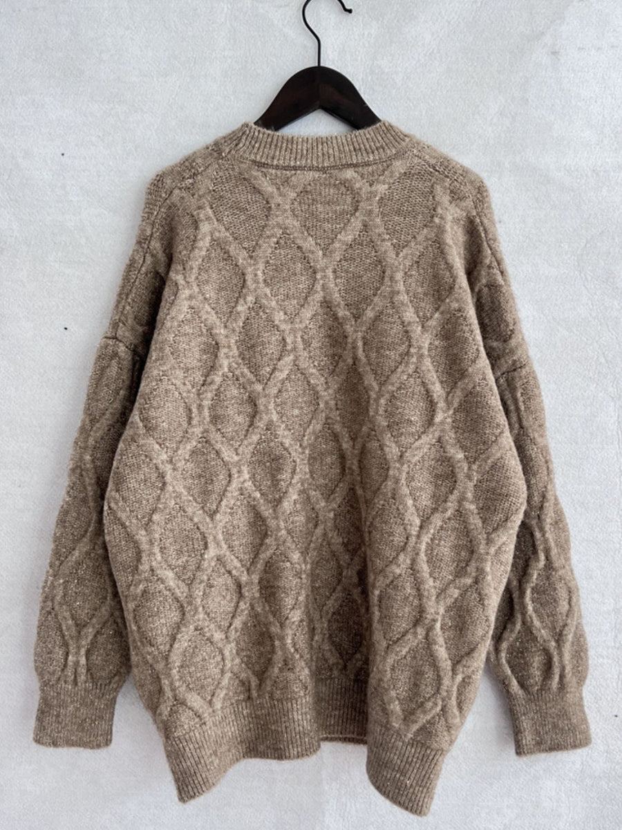 Sparkle knit relaxed fit sweater in beige with diamond cable knit pattern and crewneck.