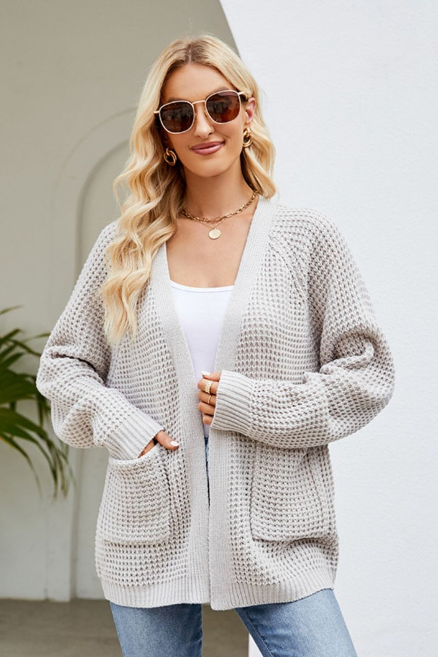 Light Gray waffle knit cardigan with patch pockets and open front.