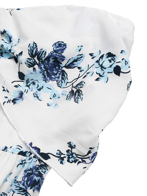 White floral smocked tie-front wide-leg romper with blue floral print detail.