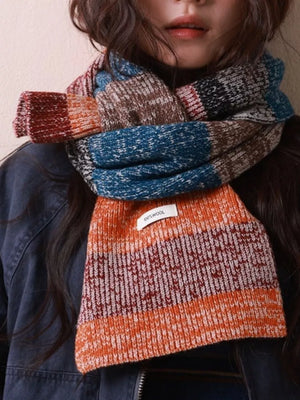 Textured wool color block scarf with orange, blue, brown, and red stripes.