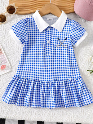 Baby blue gingham polo dress with white collar, short sleeves, and embroidered golf clubs.
