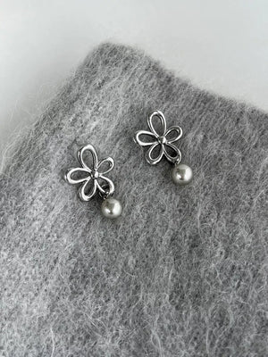 silver earrings with flower motif and null