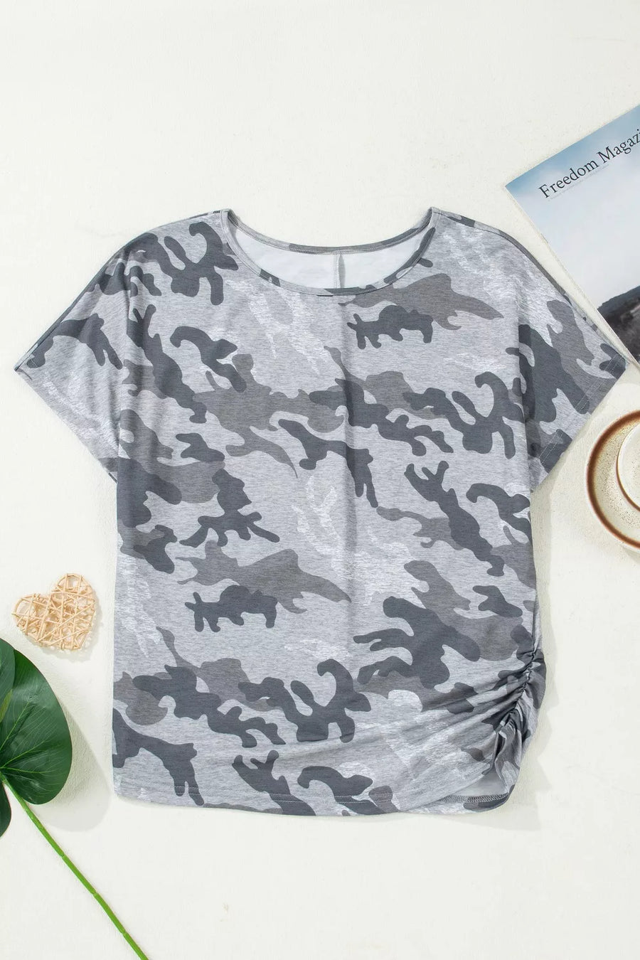 Grey camo print t-shirt with crew neck, short sleeves, and ruched side detail.