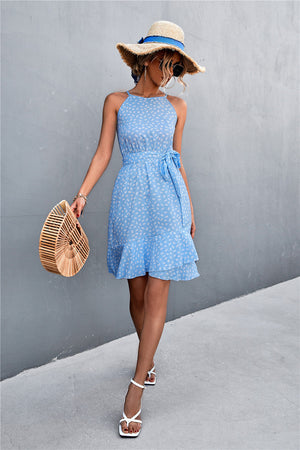 Pastel blue dotted halter neck mini dress with ruffle hem and tie waist.