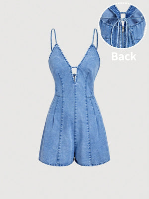 romper in light wash denim blue featuring tied and fitted fit