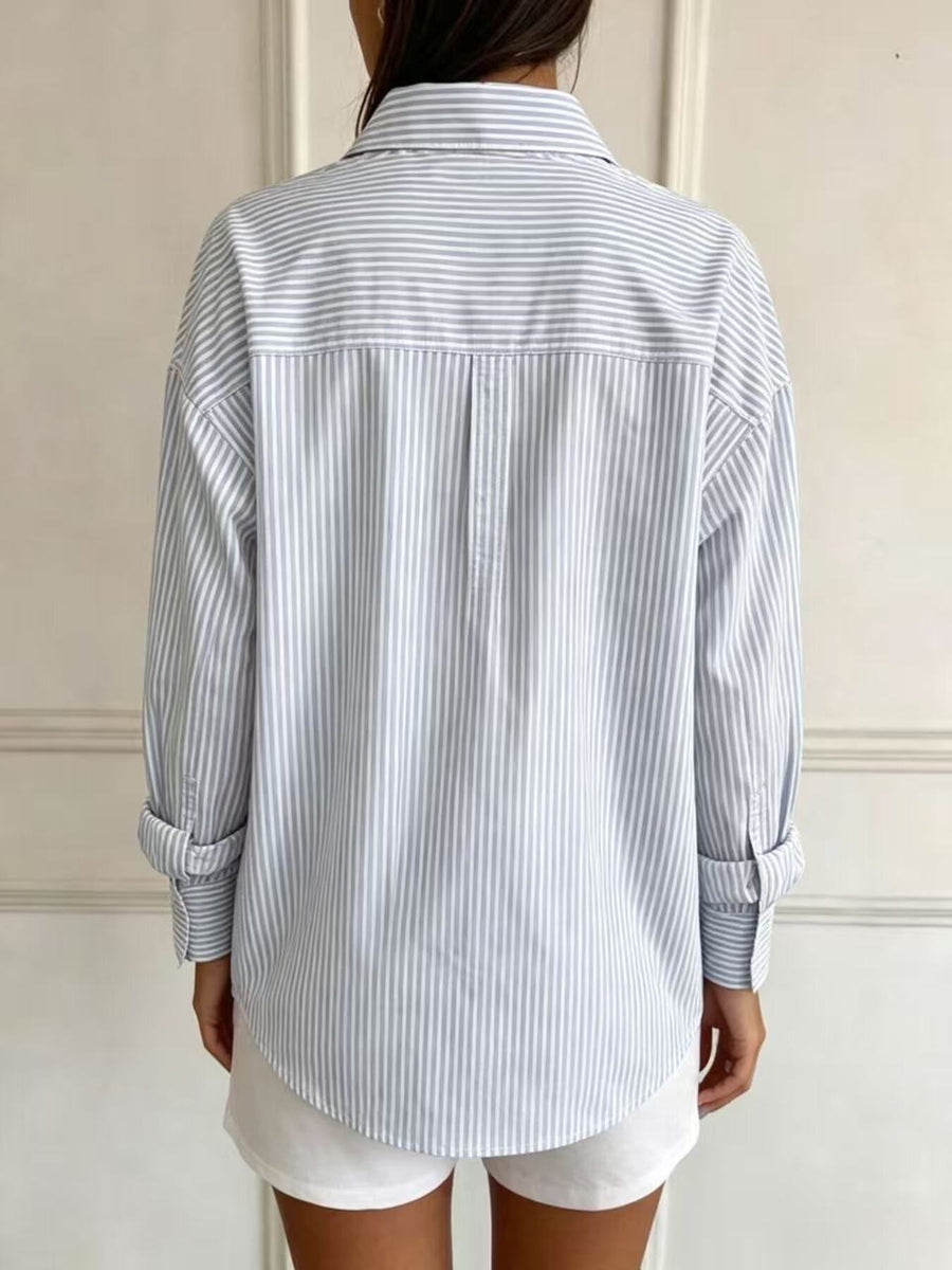 95% polyester, 5% spandex Care instructions: Machine wash cold button-down shirt in White with relaxed silhouette