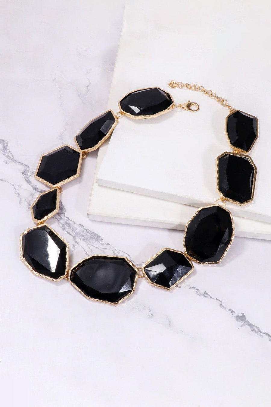 Black resin stone collar necklace with gold-tone alloy chain and clasp.