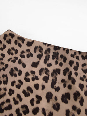 Flowy leopard print maxi skirt in beige with black animal spots.