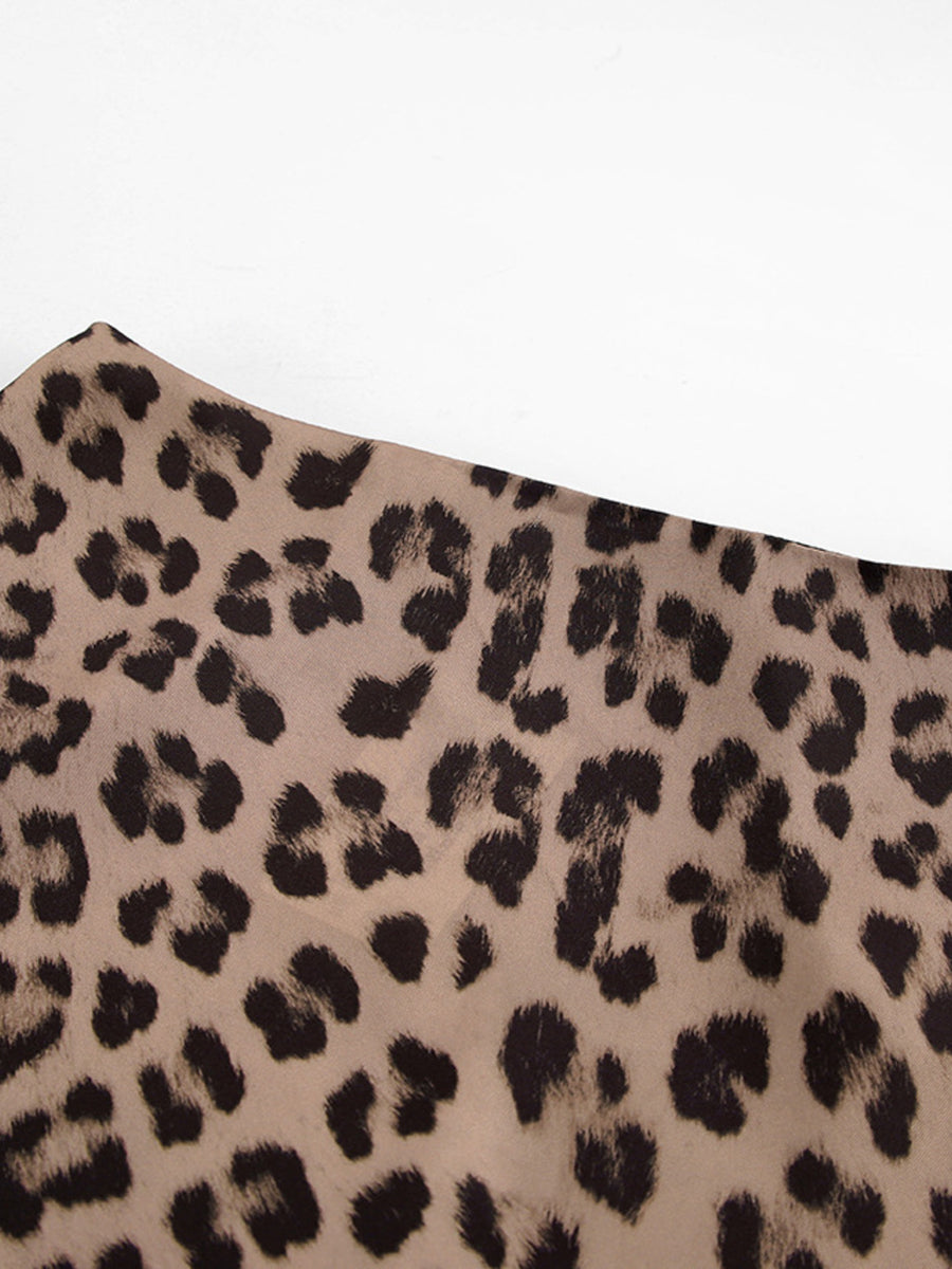 Flowy leopard print maxi skirt in beige with black animal spots.