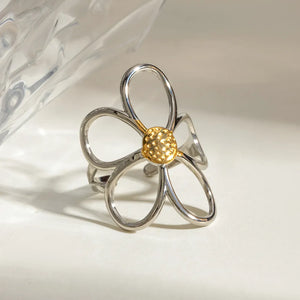ring featuring floral in gold with mixed metal texture
