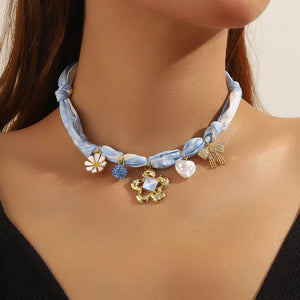 necklace in light blue featuring charms and straight fit
