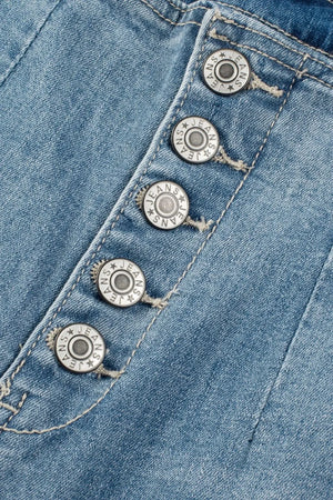 Button-fly wide-leg denim trousers in medium wash with branded silver buttons.