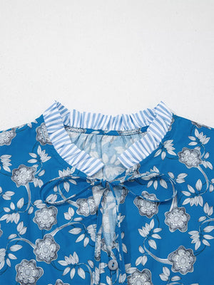 Blue floral cotton blouse with tie neck and ruffled collar