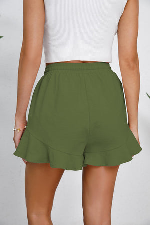 Green linen blend shorts with flounce hem and drawstring waist.