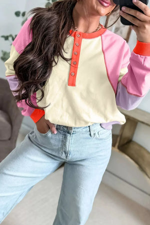 pullover sweater in light pink with color-block and exposed seams