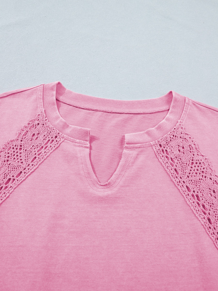 Pink mineral wash cotton tee with notched neckline and crochet lace detail.