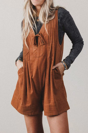 100% polyester Care instructions: Machine wash cold romper in rust with relaxed silhouette