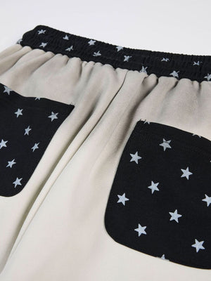 wide-leg pants featuring baroque print | script print | star print in light beige with 95%polyester,5%spandex Care
