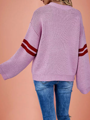 red pullover sweater featuring ribbed cuffs and heart-print