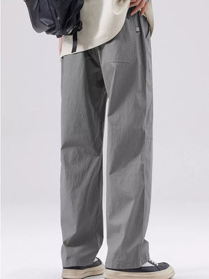Men's grey casual wide-leg sweatpants with a relaxed fit and pocket detail.