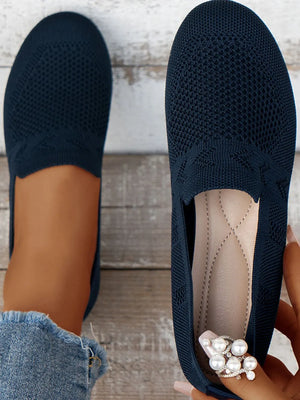 Dark navy breathable knit slip-on loafers with a diamond pattern detail.