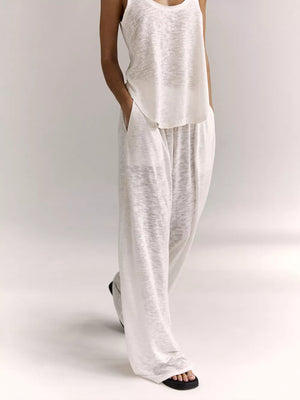 White cropped tank and wide-leg lounge pants set with pockets.