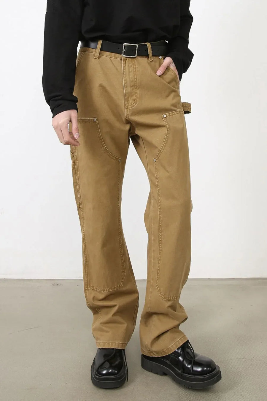 Carpenter-inspired camel wide leg trousers with utility pockets and a hammer loop detail.