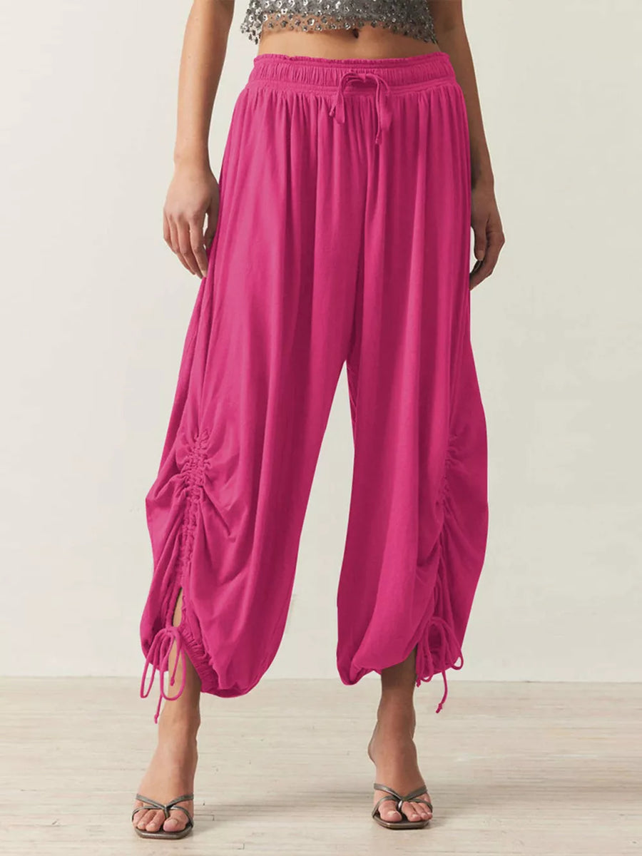 harem pants in fuchsia featuring ruched and loose fit