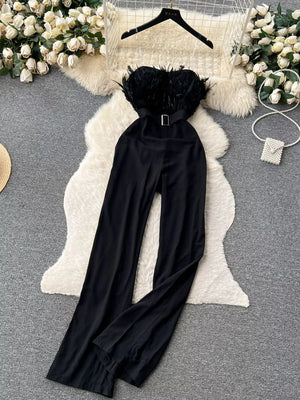 Black strapless wide-leg jumpsuit with feather trim and belt