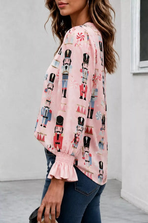 blouse in light blue with nutcracker print and ruffled