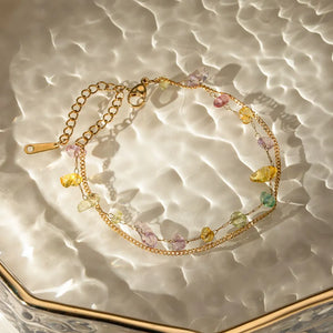Gold double chain bracelet with colorful raw gemstones and 18K gold plating