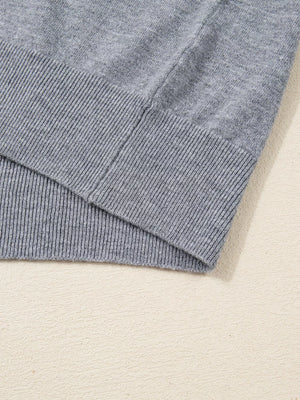 Gray ribbed V-neck sweater with ribbed hem detail