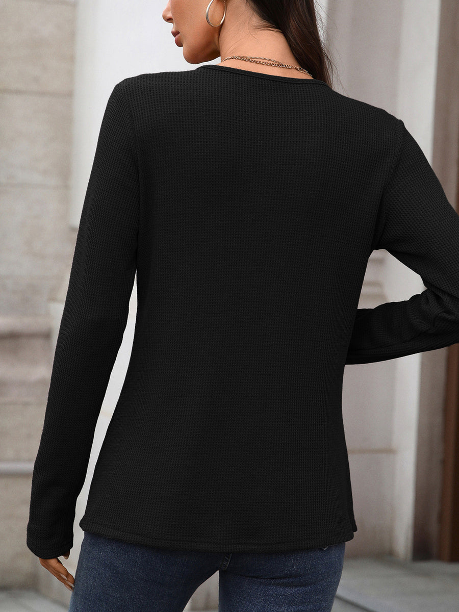Black waffle knit long sleeve t-shirt with a crew neck, shown from the back.
