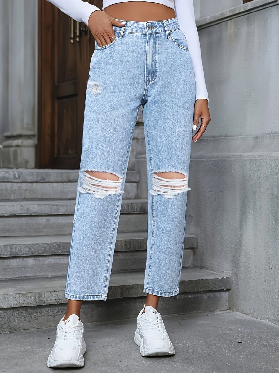 Light wash distressed boyfriend jeans with ripped knees and a bow detail.