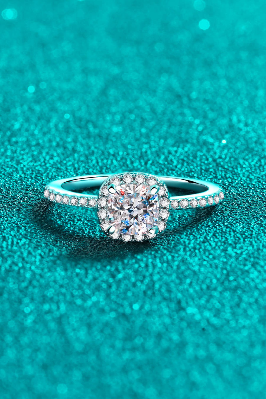 Silver pavé ring with cushion cut moissanite center stone.