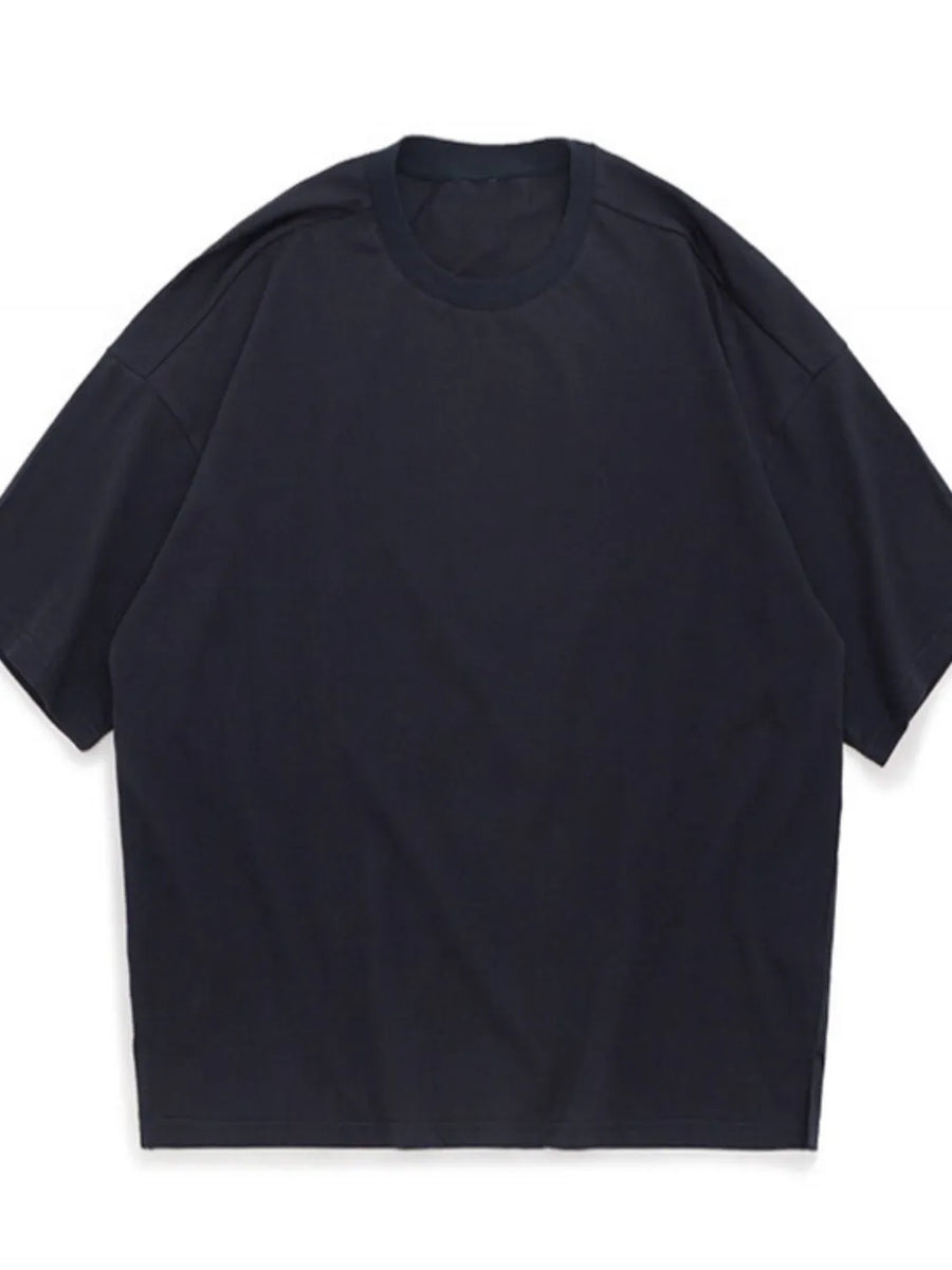Oversized crew neck t-shirt in dark gray with textured fabric and dropped shoulders.