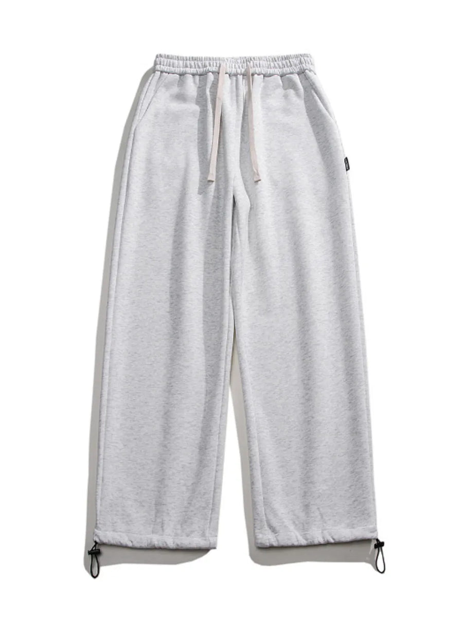 Light gray cotton sweatpants with drawstring waist and adjustable ankle cuffs.