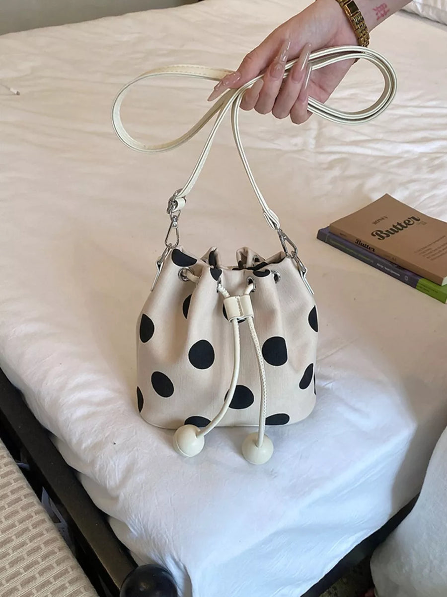 cream crossbody bag with drawstring and polka dot