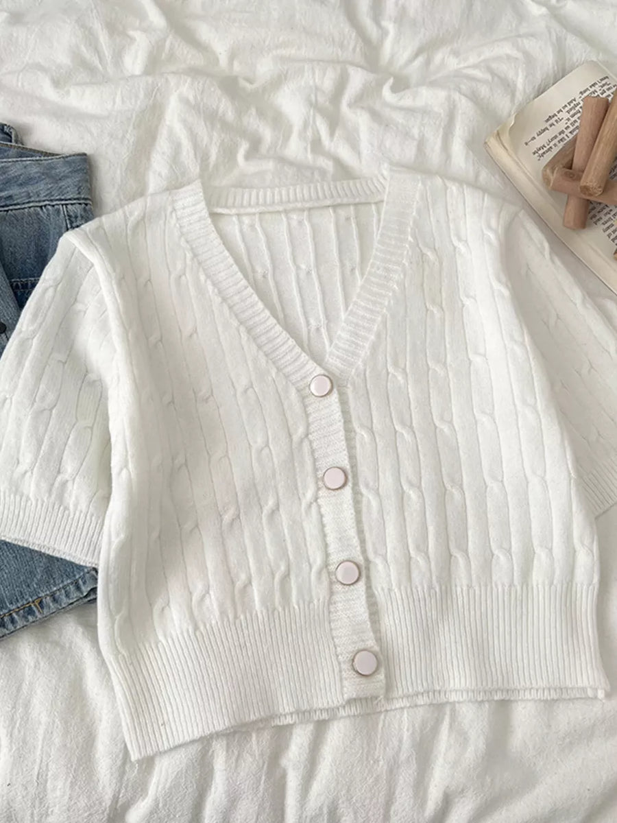 White cable-knit cropped cardigan with button front and V-neck