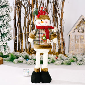 Festive Plaid Snowman decoration with red scarf and hat, wearing a plaid coat and black boots.