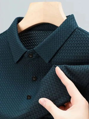 Deep Teal textured pique polo with refined collar and button placket.