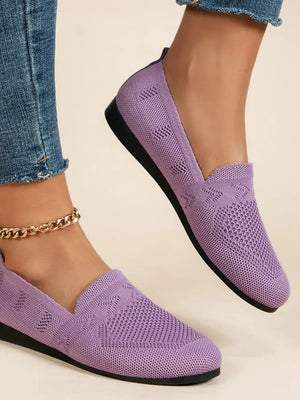 Lilac breathable knit slip-on loafers with a diamond pattern detail.