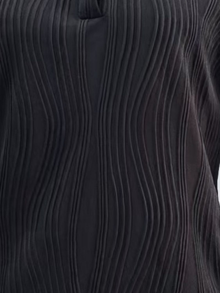Black collared blouse with wave-effect pleats