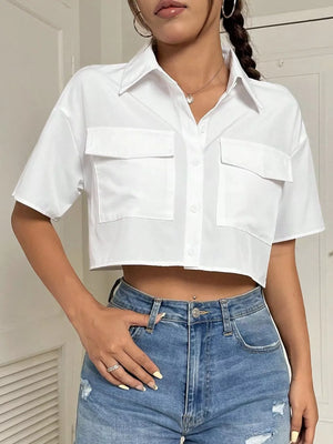 button-up shirt in white featuring chest pocket and relaxed fit