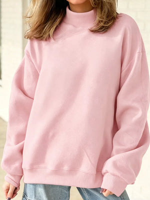 Mock Neck Dropped Shoulder Sweatshirt in Blush Pink with exposed seam