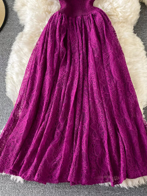Fuchsia lace maxi dress with ruffled detail and high neckline.