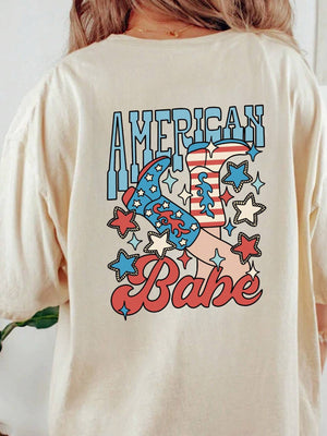 Tan graphic t-shirt with American Babe cowboy boot and star design