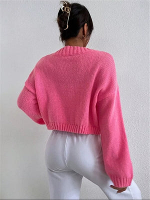 Hot Pink acrylic button cardigan with ribbed cuffs and hem, shown from the back.