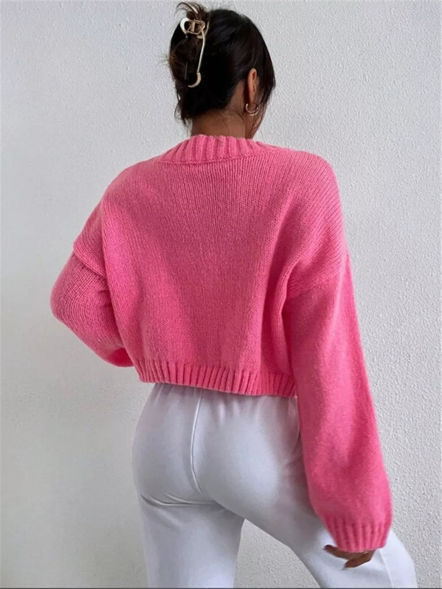 Hot Pink acrylic button cardigan with ribbed cuffs and hem, shown from the back.